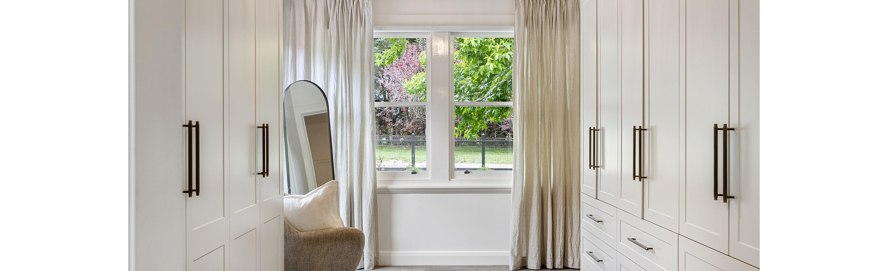 Matte wardrobe doors in a modern bedroom showing contrasting finishes