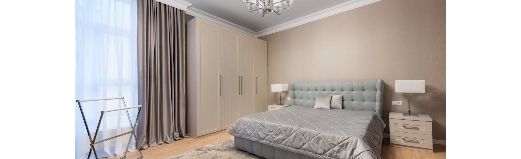 Replacement wardrobe doors fitted onto an existing wardrobe frame in a modern bedroom