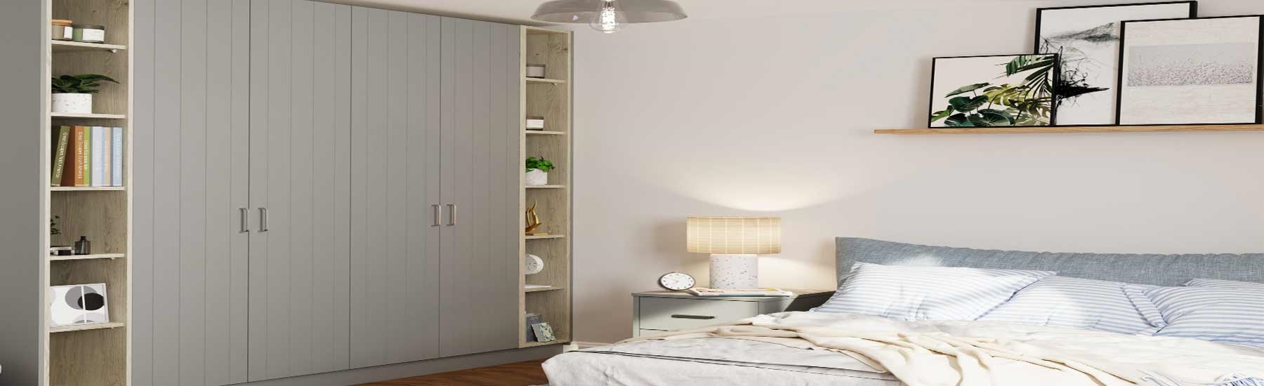 Modern light-coloured fitted wardrobe doors in a small bedroom creating a bright and spacious feel