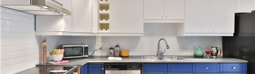 Kitchen with blue and yellow coloured cabinet doors