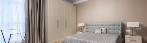 Replacement wardrobe doors fitted onto an existing wardrobe frame in a modern bedroom